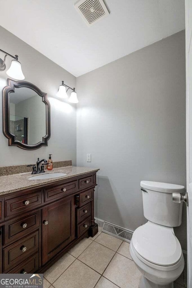 182 Hickory Dr, Ringgold, GA 30736 - bathroom featuring tile patterned floors, vanity, visible vents, and toilet