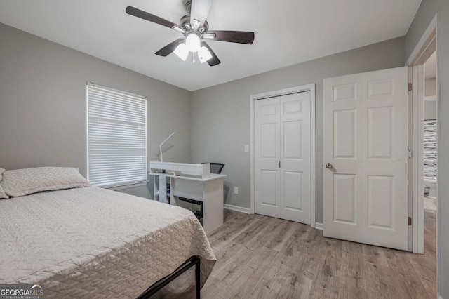 182 Hickory Dr, Ringgold, GA 30736 - bedroom featuring a closet, baseboards, light wood finished floors, and ceiling fan