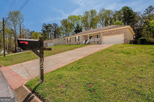 182 Hickory Dr, Ringgold, GA 30736 - ranch-style home with brick siding, driveway, a garage, and a front lawn