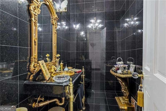 bathroom with tile walls and vanity