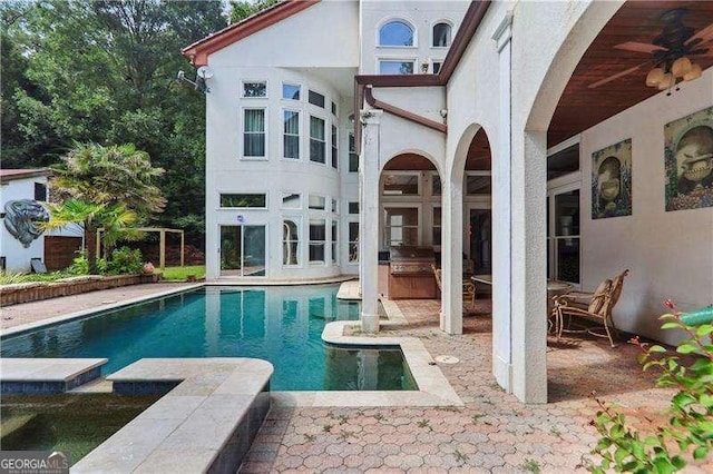 outdoor pool with a patio area