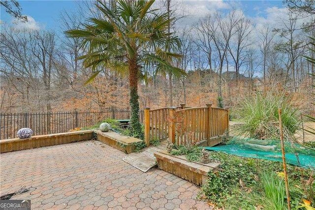 view of patio featuring fence