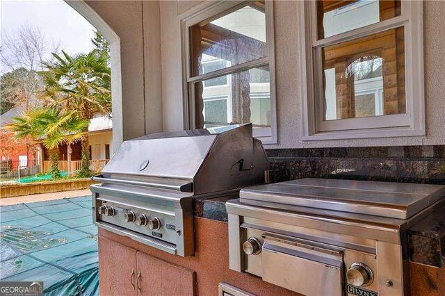 view of patio with a grill and area for grilling