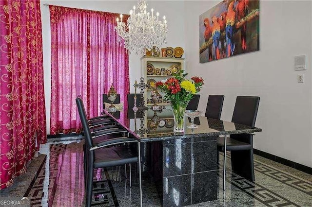 dining room with baseboards and an inviting chandelier
