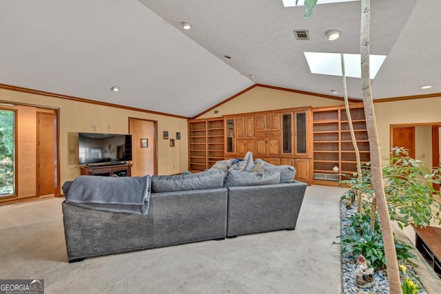 living room with a skylight, carpet, vaulted ceiling, recessed lighting, and ornamental molding