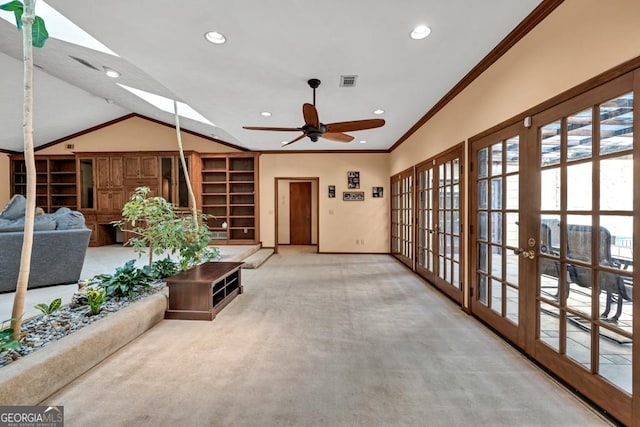 carpeted living area with baseboards, recessed lighting, a ceiling fan, crown molding, and built in shelves