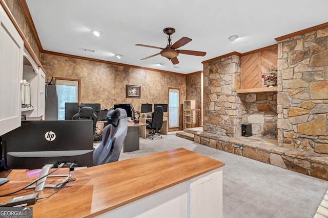 office space with ornamental molding, a ceiling fan, and light carpet