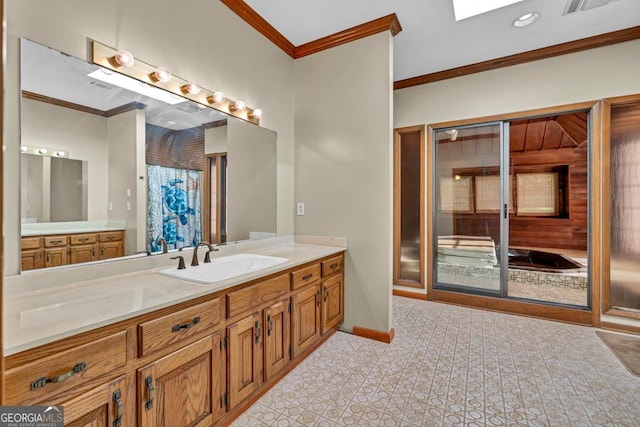 bathroom with ornamental molding, vanity, baseboards, and a shower