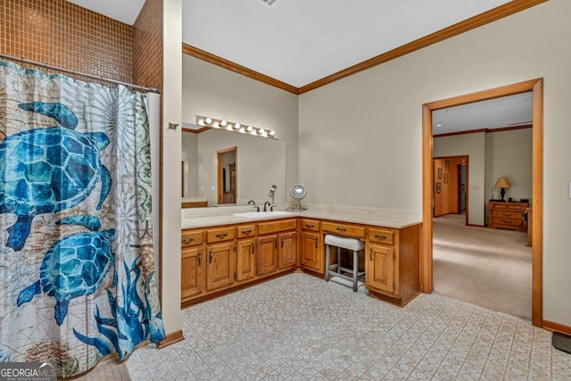 bathroom with crown molding, vanity, and curtained shower
