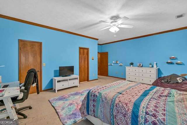 carpeted bedroom featuring ornamental molding, ceiling fan, and baseboards