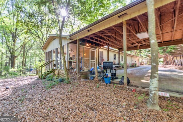 view of side of property with a sunroom