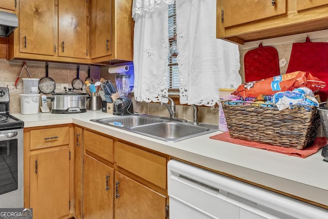 kitchen with white dishwasher, stainless steel range with electric cooktop, under cabinet range hood, light countertops, and a sink
