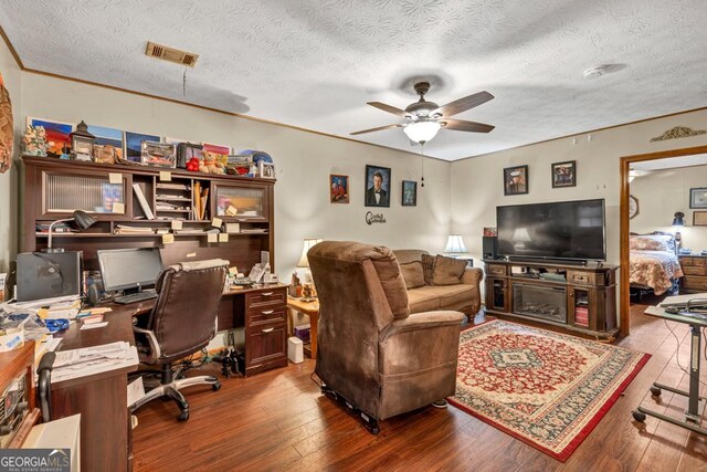 office area featuring a ceiling fan, hardwood / wood-style flooring, and a textured ceiling