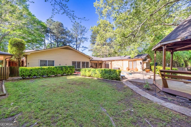 back of house featuring a deck