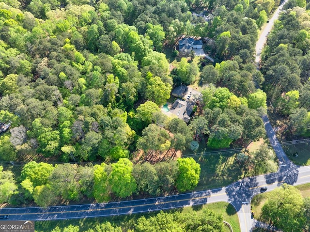 drone / aerial view of a heavily wooded area
