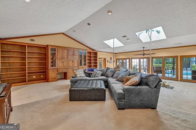 living room with a skylight, light carpet, recessed lighting, plenty of natural light, and lofted ceiling