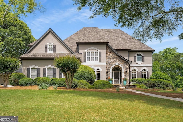 6201 Neely Farm Dr, Peachtree Corners, GA 30092 - french provincial home with stucco siding, a front lawn, and stone siding