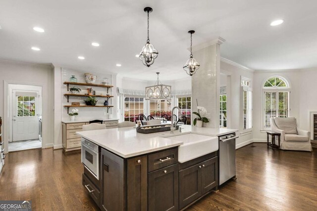 6201 Neely Farm Dr, Peachtree Corners, GA 30092 - kitchen featuring stainless steel appliances, a sink, ornamental molding, light countertops, and dark brown cabinets