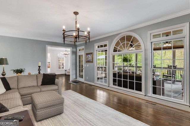6201 Neely Farm Dr, Peachtree Corners, GA 30092 - living area with a chandelier, wood finished floors, crown molding, and baseboards