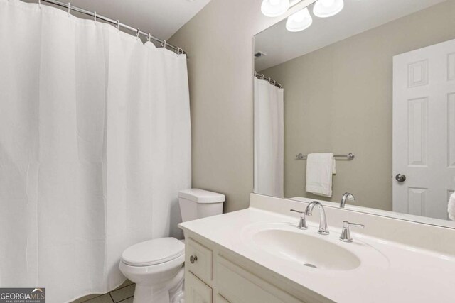 6201 Neely Farm Dr, Peachtree Corners, GA 30092 - full bath with toilet, vanity, and tile patterned flooring