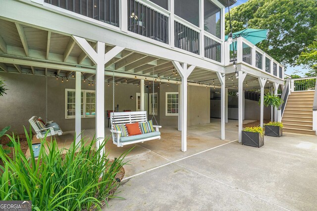 6201 Neely Farm Dr, Peachtree Corners, GA 30092 - view of patio / terrace featuring stairway, a sunroom, and a wooden deck