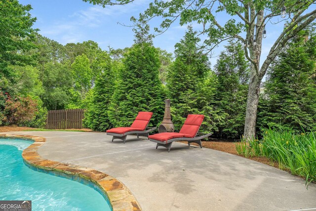 6201 Neely Farm Dr, Peachtree Corners, GA 30092 - swimming pool with a patio and fence