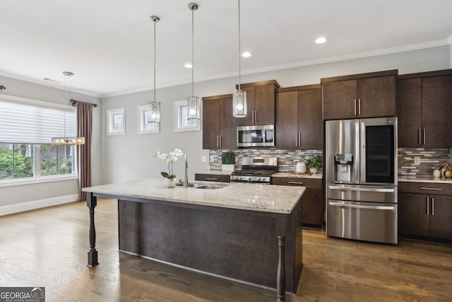 kitchen with a sink, ornamental molding, dark wood-type flooring, and stainless steel appliances