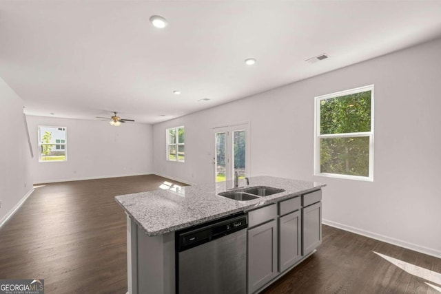 1612 Oakbrook Pond Pl, Dacula, GA 30019 - kitchen with stainless steel dishwasher, gray cabinetry, a kitchen island with sink, dark wood-type flooring, and light stone countertops