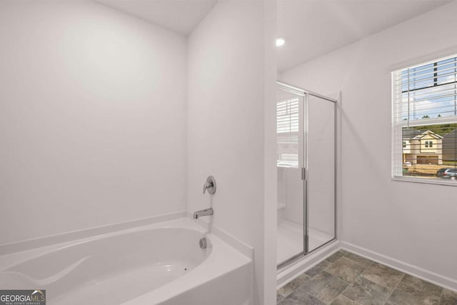 bathroom with a garden tub, recessed lighting, and a shower stall