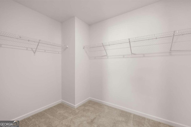 corridor with dark wood finished floors, baseboards, visible vents, and recessed lighting