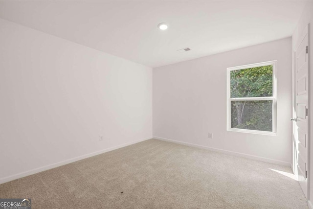 unfurnished bedroom with baseboards, carpet floors, and a closet