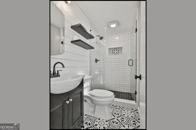 325 Sweetbriar Ln, Griffin, GA 30224 - full bath featuring toilet, a textured ceiling, tile patterned flooring, vanity, and a stall shower