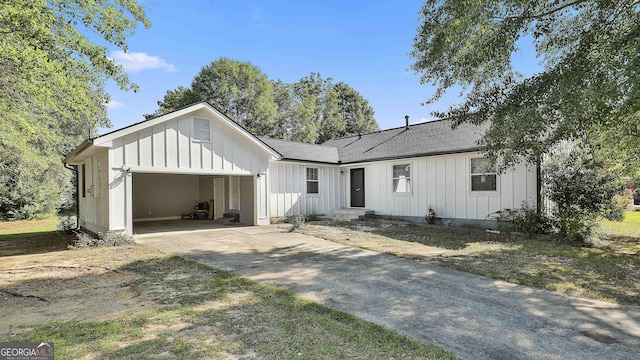 325 Sweetbriar Ln, Griffin, GA 30224 - modern inspired farmhouse with concrete driveway, roof with shingles, board and batten siding, and an attached garage