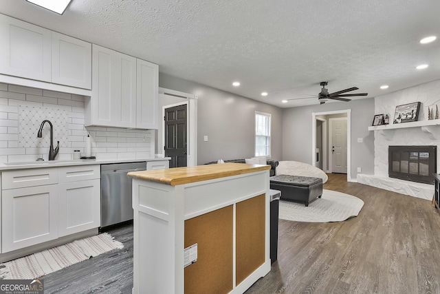325 Sweetbriar Ln, Griffin, GA 30224 - kitchen with a sink, wood counters, dishwasher, and dark wood-type flooring