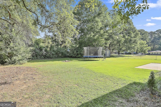 325 Sweetbriar Ln, Griffin, GA 30224 - view of yard with a trampoline and fence