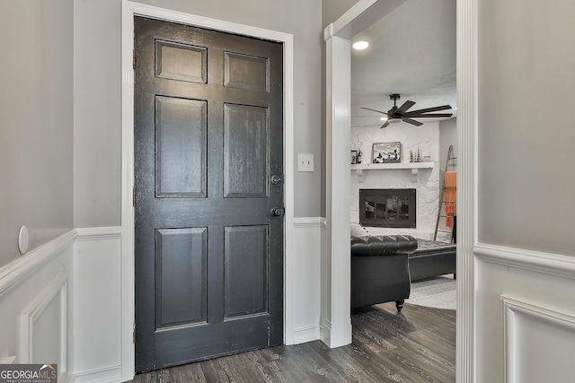 325 Sweetbriar Ln, Griffin, GA 30224 - foyer featuring ceiling fan, a fireplace, and dark wood finished floors
