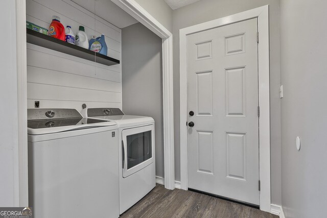 325 Sweetbriar Ln, Griffin, GA 30224 - laundry area featuring dark wood-type flooring, laundry area, baseboards, and washer and clothes dryer