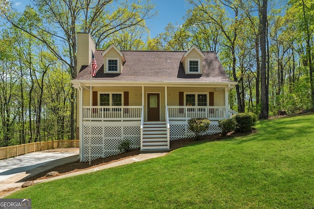 388 Pine Trl, Canton, GA 30115 - cape cod house with a front yard, covered porch, and roof with shingles