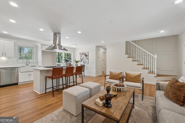 388 Pine Trl, Canton, GA 30115 - living room with recessed lighting, stairs, and light wood-style flooring