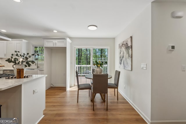 388 Pine Trl, Canton, GA 30115 - dining space with baseboards, recessed lighting, plenty of natural light, and wood finished floors