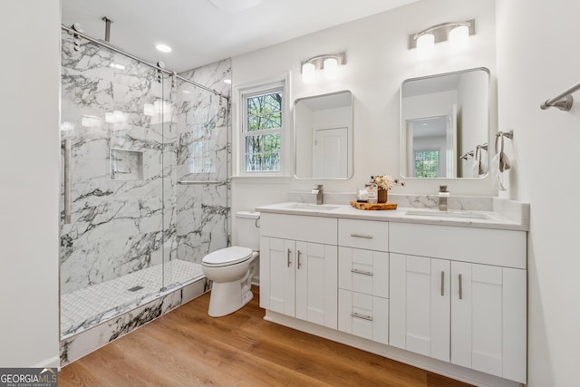 388 Pine Trl, Canton, GA 30115 - full bathroom featuring a sink, toilet, a marble finish shower, and wood finished floors