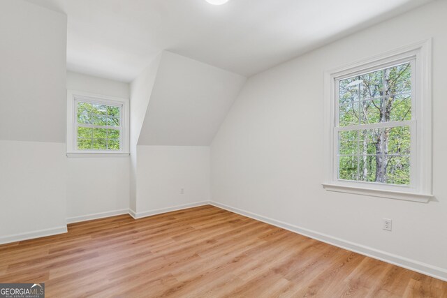 388 Pine Trl, Canton, GA 30115 - bonus room featuring light wood-style floors, baseboards, and vaulted ceiling