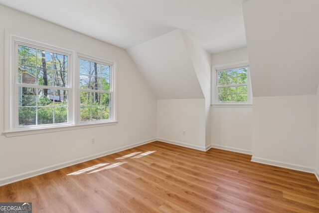 388 Pine Trl, Canton, GA 30115 - bonus room with light wood-type flooring, baseboards, and vaulted ceiling