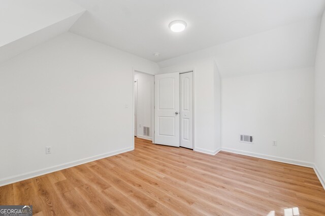 388 Pine Trl, Canton, GA 30115 - unfurnished bedroom with light wood-style floors, visible vents, and baseboards