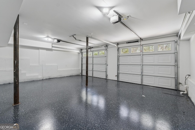388 Pine Trl, Canton, GA 30115 - garage featuring a garage door opener
