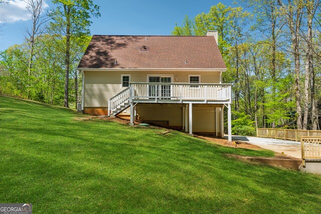 388 Pine Trl, Canton, GA 30115 - rear view of house featuring a chimney, stairs, a yard, a deck, and a shingled roof
