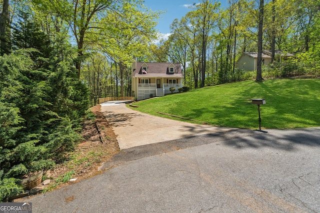 388 Pine Trl, Canton, GA 30115 - view of front of house with a porch, a front lawn, and aphalt driveway