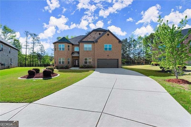 traditional-style house featuring a front lawn, a garage, and concrete driveway