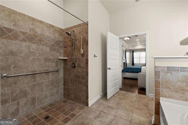 ensuite bathroom with tile patterned flooring, ensuite bathroom, and a tile shower