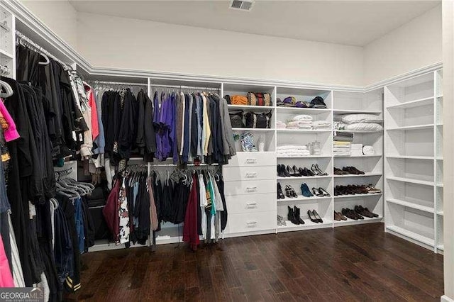 walk in closet with wood finished floors and visible vents